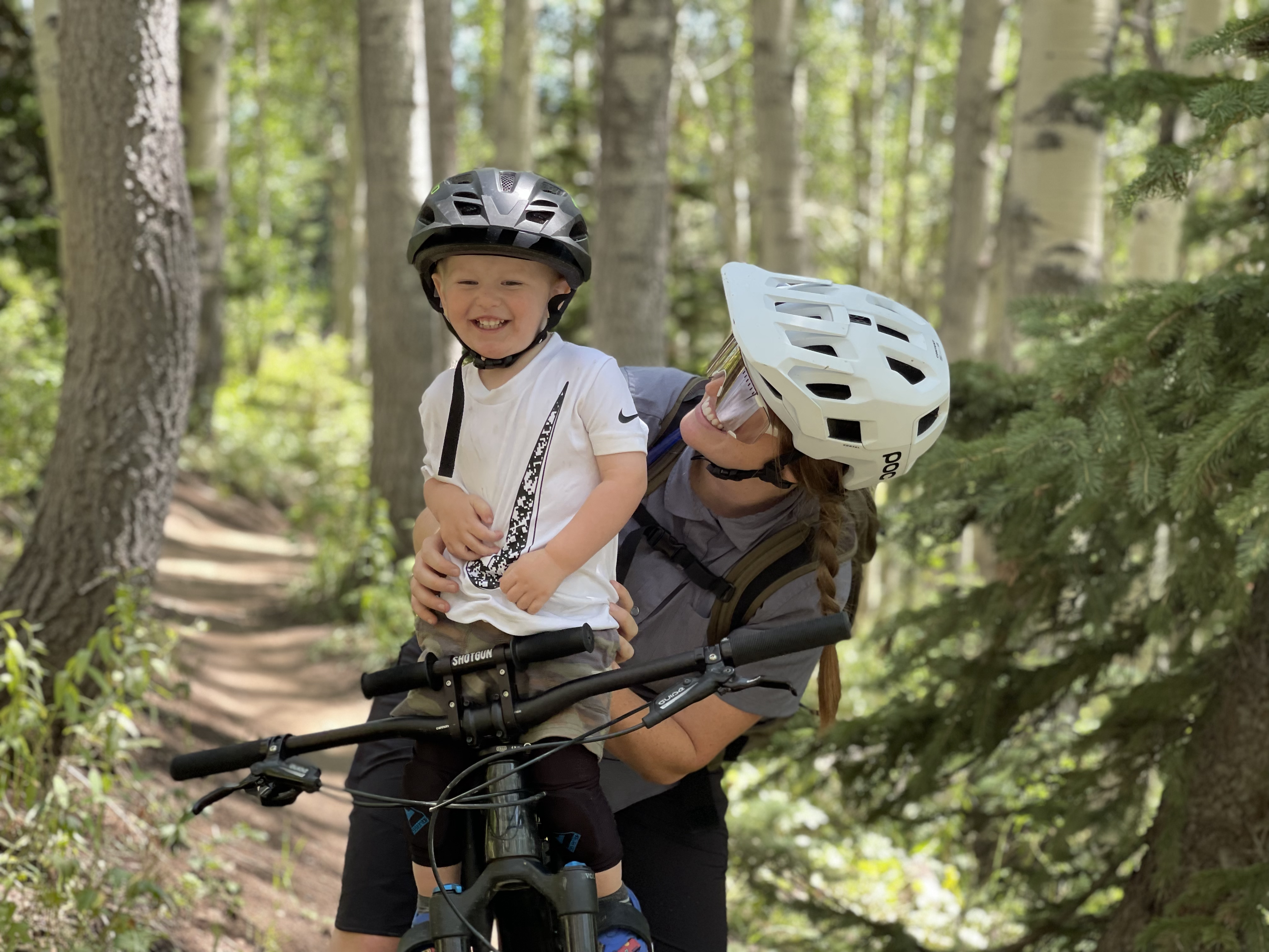 Mom and toddler with a child mountain bike seat